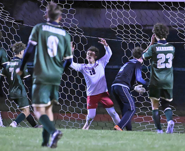 131864308_web1_WA-PA-BSCR-3
Pittston Areas Lonnie Maldonado (18) raises his arms after scoring a goal to tie the game against Wyoming Area 1-1 in the first half.
Tony Callaio | For Sunday Dispatch