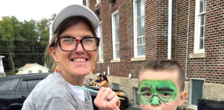 
			
				                                Heather D’Anna paints Nico Davis’ face during trunk or treat at the Second Presbyterian Church, Pittston.
                                 Submitted photo

			
		