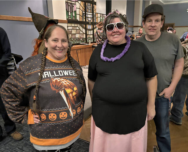 <p>Sherry McHale, left, Christina Wesley, center, and David Moran took part in the Victory Sports Halloween party at St. Joseph Marello Parish Hall.</p>
                                 <p>Tony Callaio | For Sunday Dispatch</p>