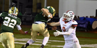 
			
				                                Wyoming Area QB Jack Gravine (6) eludes one more tackle before scoring a 15-yard touchdown against Pittston Area on Friday night.
                                 Tony Callaio | For Times Leader

			
		