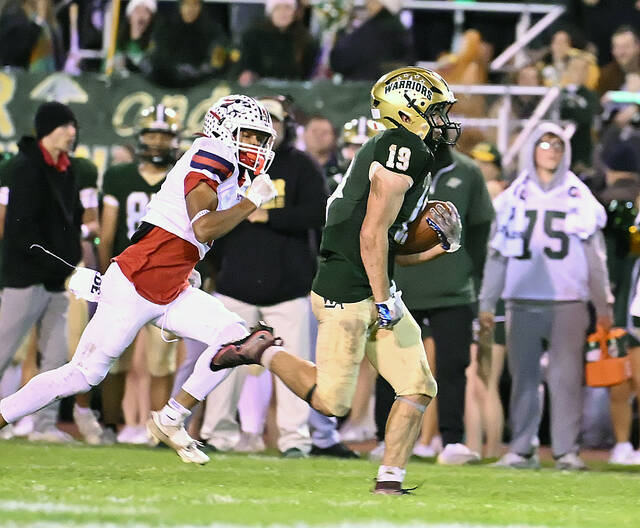 <p>Game MVP Warrior Nick Ciampi (19) legs out a 44-yard run in the second half against Pittston Area.</p>
<p>Tony Callaio | For Times Leader</p>