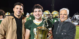 
			
				                                The Wyoming Area/Pittston Area rival football game MVP went to Warrior Nick Ciampi. From left are: Sam Falcone, Ciampi, and Camen Falcone, handing over the Carmelo Falcone MVP Memorial Award.
                                 Tony Callaio | For Sunday Dispatch

			
		