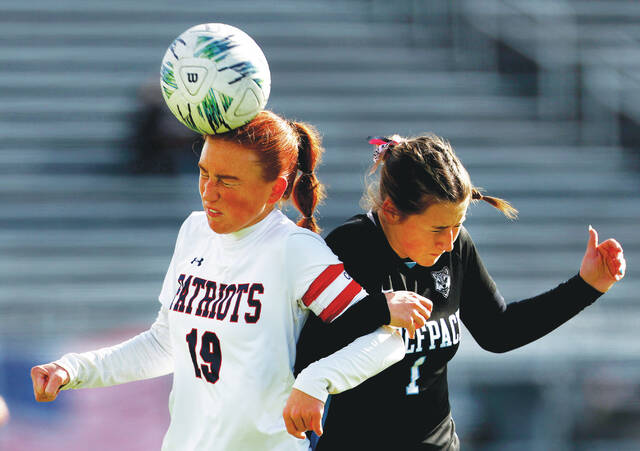 <p>Pittston Area’s Camryn Karp (19) heads the ball away from Wilkes-Barre Area’s Ann Cielski in the first half.</p>
<p>Fred Adams | For Times Leader</p>