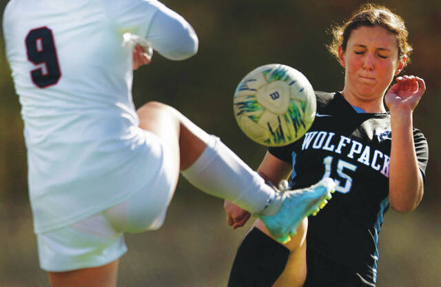 <p>Wilkes-Barre Area’s Leah Pryor (15) has the ball kicked away from her by Pittston Area’s Rebecca Dunn during the first half.</p>
<p>Fred Adams | For Times Leader</p>