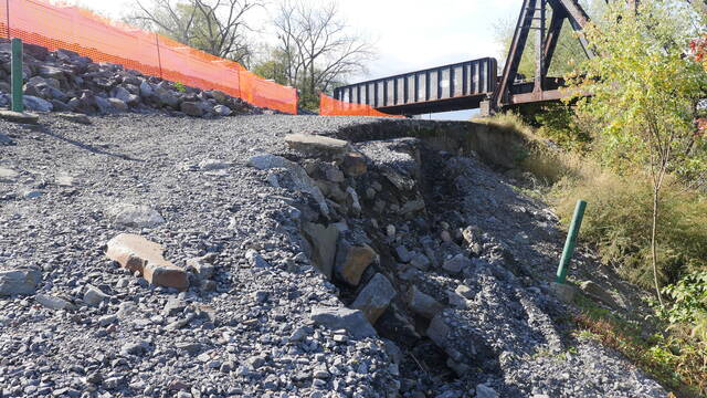 131894167_web1_fpa 
			
				                                Erosion inching toward part of the Wyoming Valley Levee system flood wall along Riverside Drive in Wilkes-Barre prompted the Luzerne County Flood Protection Authority to approve a surveying assessment Thursday. The flood wall is behind the orange netting.
                                 Jennifer Learn-Andes | Times Leader