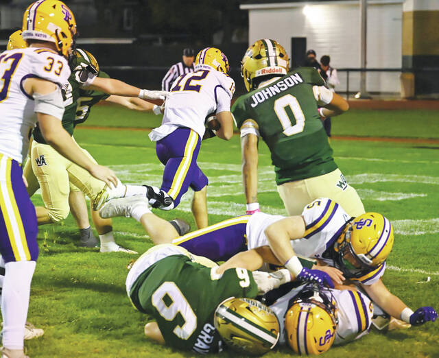 131897743_web1_WA-Prep-ftbl-2
Scranton Prep quarterback Will McPartland (12) rushes for a touchdown in Friday nights District 2 Class 3A semifinals. McPartlands return from knee surgery has made the Cavaliers a different team.
Tony Callaio | For Times Leader