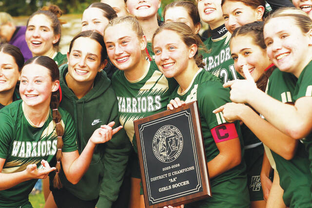 131899746_web1_wyo_mv5_faa
The Wyoming Area girls pose with their District 2 Class 2A championship plaque after defeating Mid Valley 3-1 Saturday.
Fred Adams | For Times Leader