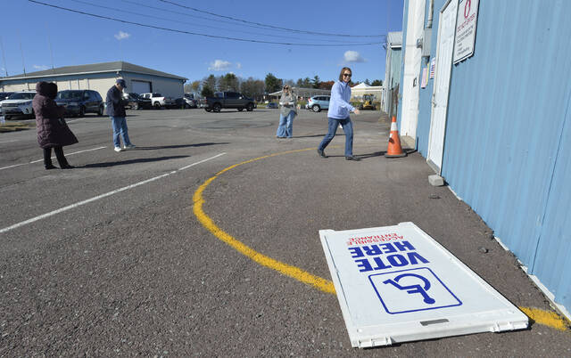 131904850_web1_Pic-2
A lone voter arrives to vote in Dallas Twp. on a windy day that toppled the vote here sign.
Mark Moran | For Times Leader