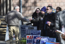 Luzerne County voter turnout higher than usual in Tuesday’s general election
Campaign workers distribute cards as voters arrive at a polling place in Kingston on Tuesday.
Mark Moran | For Times Leader