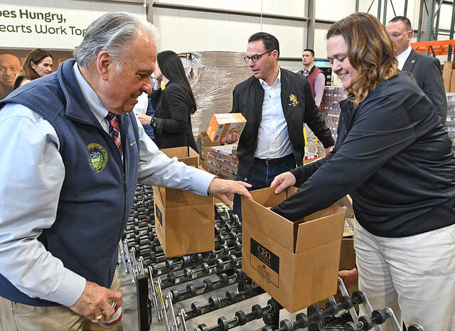 <p>PA Gov. Josh Shapiro, center, give a helping hand to Jennifer Warabak, Weinberg NE Regional Food Bank CEO, right, and PA Rep. Eddie Day Pashinski, left, at the Weinberg Food Bank. Gov. Shapiro was at the Pittston Twp. warehouse to update PA residents on the SNAP Emergency Relief Fund.</p>
<p>Tony Callaio | For Sunday Dispatch</p>