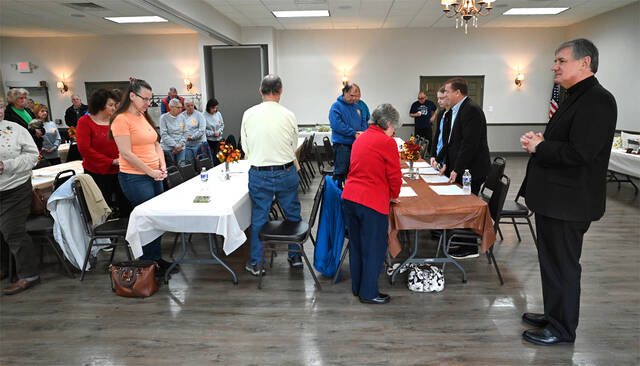 131932899_web1_Holy-Mother-Sorrows-Vets-Day-Lunch-1
The Very Rev. Dawid Zbigniew, Holy Mother of Sorrows Polish National Catholic Church, pastor, right, stands to the left of Forty Forty United Methodist Church pastor, Richard Bradshaw, as Bradshaw administers the pre-meal prayer to honor veterans and EMS workers at the church hall.
Tony Callaio | For Sunday Dispatch