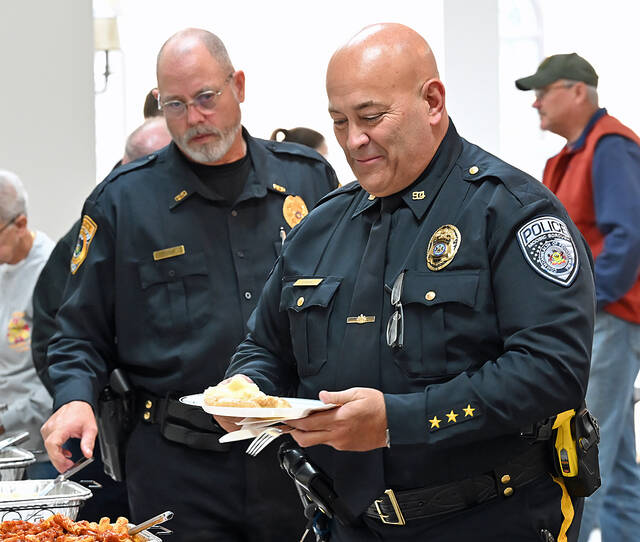 <p>Moosic Borough Police Chief Richard Jenesko, right, and Dupont Borough Police Chief Sean Doran, left, took part in the Veterans Day/EMS lunch at Holy Mother of Sorrows Church, Dupont.</p>
<p>Tony Callaio | For Sunday Dispatch</p>