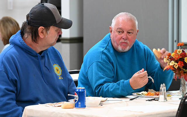 <p>George Guitson, left, of Dupont, and Robert Galuska, Duryea, both members of the Sons of American Legion Post 585, enjoy lunch given by the Holy Mother of Sorrows Church Veterans Day/EMS luncheon.</p>
<p>Tony Callaio | For Sunday Dispatch</p>