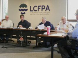 
			
				                                Luzerne County Flood Protection Authority Executive Director Christopher Belleman, at right, discusses the proposed 2026 budget, which does not recommend a levee fee increase, on Tuesday. Board members, from left, are: John Maday, Vice Chairman William Hardwick, Chairman Dominic Yannuzzi, Coray Mitchell and Jay Delaney.
                                 Jennifer Learn-Andes | Times Leader

			
		
