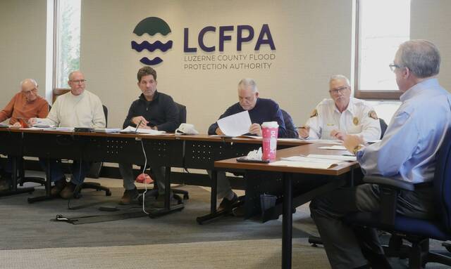131939287_web1_fpa
Luzerne County Flood Protection Authority Executive Director Christopher Belleman, at right, discusses the proposed 2026 budget, which does not recommend a levee fee increase, on Tuesday. Board members, from left, are: John Maday, Vice Chairman William Hardwick, Chairman Dominic Yannuzzi, Coray Mitchell and Jay Delaney.
Jennifer Learn-Andes | Times Leader