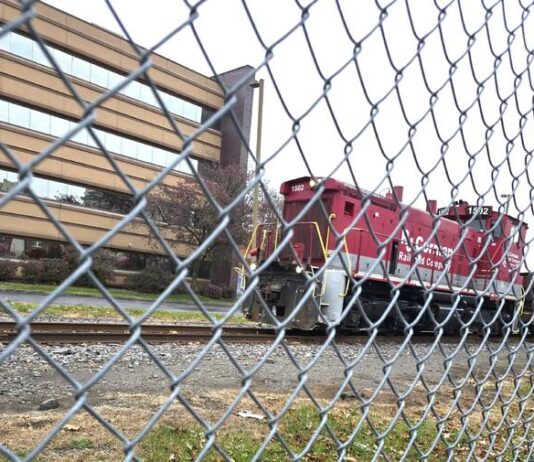 
			
				                                A train passes through Wilkes-Barre on the Luzerne County Redevelopment Authority’s rail line. The authority is in the process of finalizing a contract with an experienced planner to assist with a valuation of the county rail line and preparation of a public request seeking proposals to purchase or lease the line, Authority Board Chairman Scott Linde said Tuesday.
                                 Clarence Newcomb | Times Leader

			
		