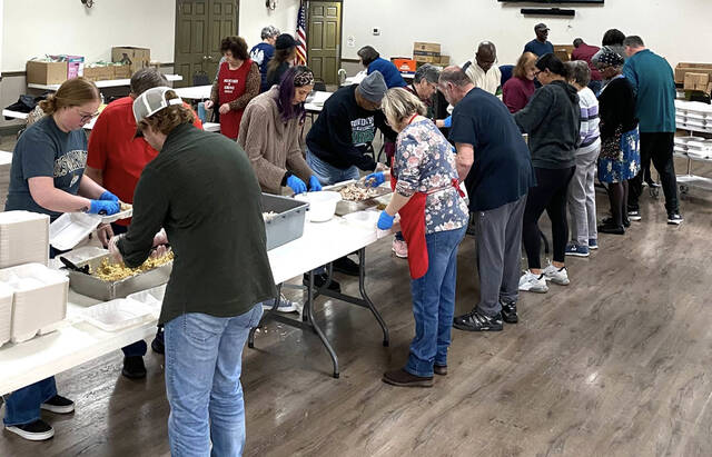 <p>A joint effort between Holy Mother of Sorrows Polish National Church, Dupont, and the First Baptist Church, Pittston, in preparing Thanksgiving dinners to be delivered in time for the holiday. The assembly line took place at Holy Mother of Sorrows Church hall.</p>
<p>Submitted photo</p>