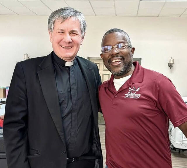 <p>Rev. Zbigniew Dawid, of Holy Mother of Sorrow Polish National Catholic Church, Dupont, left, and Rev. James Breese, of the First Baptist Church, Pittston, unit both churches in an effort to cook 70 turkeys in preparing Thanksgiving Day dinners between the two churches.</p>
<p>Submitted photo</p>