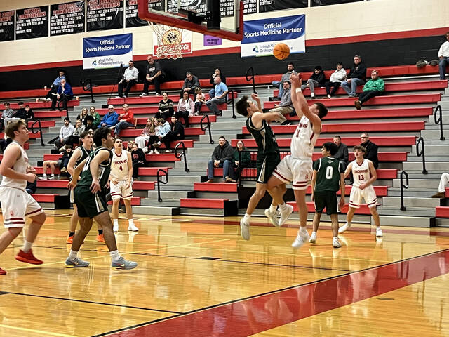 131964556_web1_WA-BoysBasketball
Luke Kopetchny follows through on a block of a shot by North Poconos Cole West in Fridays season opener.
Tom Robinson | For Sunday Dispatch