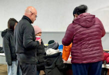 Pittston Knights of Columbus host Coats for Kids giveaway
Pittston Knight Tom Ruschel, front left, aids a family that arrived for winter coats at the Knights of Columbus for the annual Coats for Kids drive on Saturday, Dec. 6.
Submitted Photo
