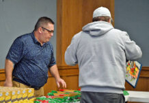 City of Pittston completes first food distribution
Greg Holl, City of Pittston employee, left, aided residents in distributing food during the City of Pittston Food Distribution Pantry held at the Cosgrove Room at the Pittston Memorial Library.
Tony Callaio | For Sunday Dispatch