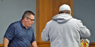 
			
				                                Greg Holl, City of Pittston employee, left, aided residents in distributing food during the City of Pittston Food Distribution Pantry held at the Cosgrove Room at the Pittston Memorial Library.
                                 Tony Callaio | For Sunday Dispatch

			
		
