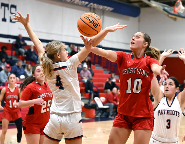 <p>Pittston Area’s Leah Drozginski (4) fouls Crestwood’s Charlie Hiller (10) on her way to a layup.</p>
<p>Tony Callaio | For Times Leader</p>