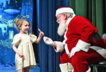 Tiny Learners Learning Center presents Christmas program
Alessa Daley gets a candy cane from Santa Claus at the conclusion of Tiny Learners Learning Centers Christmas concert.
Tony Callaio | For Sunday Dispatch
