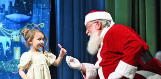 
			
				                                Alessa Daley gets a candy cane from Santa Claus at the conclusion of Tiny Learners Learning Centers Christmas concert. 
                                 Tony Callaio | For Sunday Dispatch

			
		
