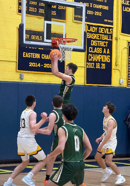 <p>Wyoming Area’s Luke Kopetchny goes high for a rebound as Old Forge’s Logan Fanning (13) and Wyoming Area’s Drew Keating battle for position, and Wyoming Area’s Shane Pepe (0) looks on.</p>
<p>Tom Robinson | For Sunday Dispatch</p>