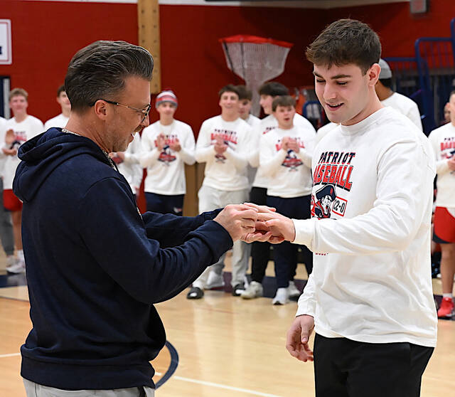 132055182_web1_PA-Baseball-Honored-1
Pittston Area head baseball coach is shown placing a 2025 PIAA D2 5A Championship ring on graduate Silvio Giardina, who now plays varsity baseball at Lehigh University.
Tony Callaio | For Sunday Dispatch
