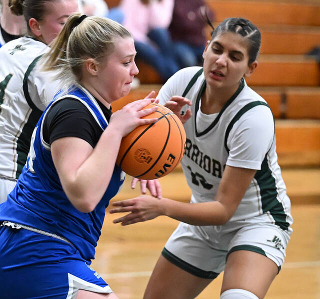 <p>The Warriors’ Abi Francis (white) looks to steal the ball off of Hanover Area’s Cait Vigorito (blue).</p>
<p>Tony Callaio | For Sunday Dispatch</p>