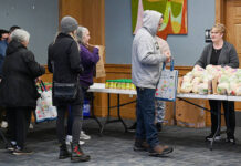 
			
				                                City of Pittston official, Sharon Sworen, far right, took part in volunteering in the very first food distribution at the Pittston Memorial Librarys Cosgrove Room in December 2025.
                                 Tony Callaio file photo | For Sunday Dispatch

			
		
