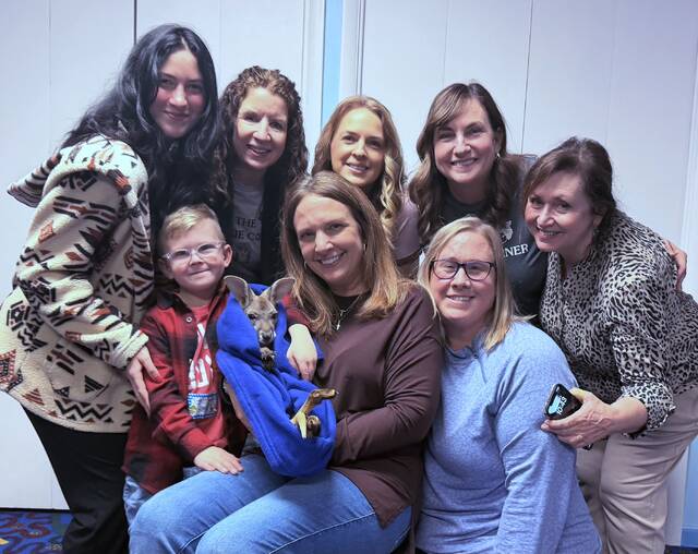 <p>From left, first row: Jack McGarry, Mrs. Toni Tabone (holding the joey, Bellaroo), and Dr. Sara McGarry. Second row: Cookie Corner educators Faith Kessell, Anne Schwartz, Theresa Guzik, Joan Urban, and Kathy Mulhern.</p>
<p>Submitted Photo</p>