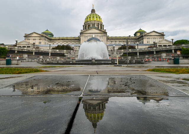 132083643_web1_131926562-9ba374dbb2c047668e60e5e6d041dfe7
The Pennsylvania State Capitol is reflected on the ground on June 30, 2025, in Harrisburg.
AP File Photo