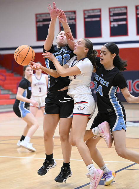 132102489_web1_PA-Hanover-GBsktbl-1
Pittston Areas Lili Hintze (white) gets into a bit of trouble as she drives the baseline, getting fouled by Wilkes-Barre Areas Alyssa Thebeault (32) and Jaydalyn Mora (24).
Tony Callaio | For Sunday Dispatch