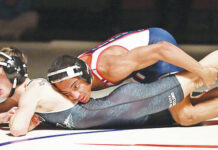 
			
				                                Mikel Roman, top, looks to turn over Wyoming Areas Chase Wilhem at 114 pounds. Roman defeated Wilhem 4-2 for a key early decision on Wednesday night.
                                 Tony Callaio | For Times Leader

			
		