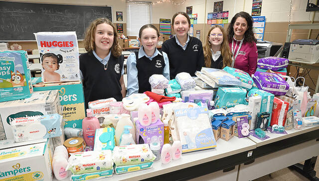 132136420_web1_WAC-St.-Joe-s-Donation
Wyoming Area Catholic Builders Club sponsored a school-wide Catholic Schools Community Service Project for Catholic Schools Week. Items collected went to St. Josephs Centers baby pantry. Some members of the Builders Club are, from left: Ella Kania, Ember Felker, Scarlett OHop, and Builders Club Advisor Tiffany Callaio.
Tony Callaio | For Sunday Dispatch