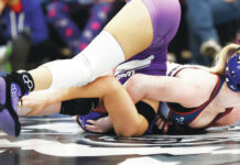 D2 wrestling championships: Hazleton Area earns WVC’s first girls team title
Nanticoke Areas Emily Kivler strains as she pins Wallenpaupacks Gia Silva in the girls 112 pound championship bout.
Fred Adams | For Times Leader