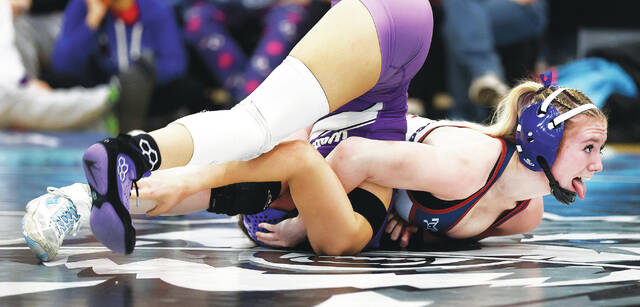 132161176_web1_w3_faa
Nanticoke Areas Emily Kivler strains as she pins Wallenpaupacks Gia Silva in the girls 112 pound championship bout.
Fred Adams | For Times Leader