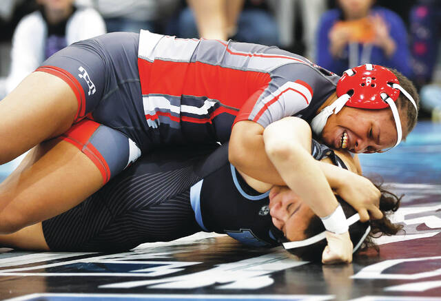 <p>Hazleton Area’s Shaniece Brown works on pinning Wilkes-Barre Area’s Jacqueline Hernandez in the girls 130 pound final.</p>
<p>Fred Adams | For Times Leader</p>