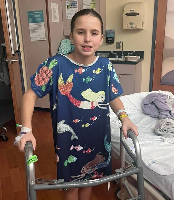 <p>Nine-year-old Lyla Seamans stands in her hospital room at Janet Weis Children’s Hospital at Geisinger, Danville, while recovering from surgeries and an infection.</p>
<p>Submitted photo</p>