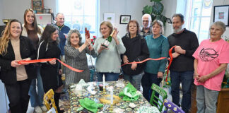 
			
				                                Tea & More owner/operator, Judy Passetti (with scissors), cuts the ribbon of the latest store at Downtown Pittston. Located on the first floor of the Reilly Building, Tea & More will serve breakfast and lunch items as well as an assortment of teas, caffeine-free teas, Polish teas, organic teas, and other beverages.
                                 Tony Callaio | For Sunday Dispatch

			
		