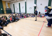 
			
				                                Adam Marco, SWB RailRiders communications director and boardcaster, along with team mascot, Champ, speak to second grade students of Wyoming Area Primary Center on the importance of reading on Thursday, March 12.
                                 Tony Callaio | For Sunday Dispatch

			
		