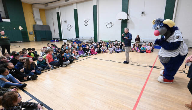 132202900_web1_WA-Primary-Railriders-Visit-1
Adam Marco, SWB RailRiders communications director and boardcaster, along with team mascot, Champ, speak to second grade students of Wyoming Area Primary Center on the importance of reading on Thursday, March 12.
Tony Callaio | For Sunday Dispatch