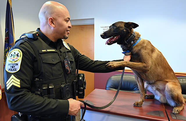<p>Pittston Twp. Police Sgt. Ruddy Navarro with his police canine Zeus at the Pittston Twp. Municipal Building. Sgt. Navarro has been Zeus’ handler and partner for five years on the force.</p>
<p>Tony Callaio | For Sunday Dispatch</p>