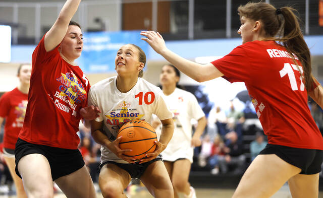 <p>Lilli Hintze (Pittston, 10) Team Grant drives to the basket as team Jezorwski ‘s Delcia Biscotto (Lake-Lehman) and Alexis Reimold (Hazleton) defend.</p>
<p>Fred Adams | For Times Leader</p>