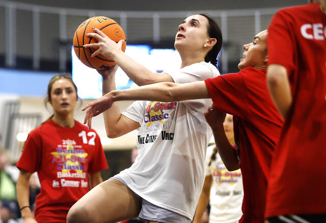 <p>Giuliana Latona (Pittston) goes to the basket for Team Grant as Kearney Quinn (Holy Redeemer) defends for Team Jezorwski.</p>
<p>Fred Adams | For Times Leader</p>