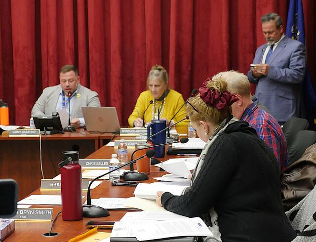 132241728_web1_councilusemarch24
Luzerne County Council members Joanna Bryn Smith and Harry Haas, in foreground, review paperwork during a break in the March 24 meeting in which an American Rescue Plan Act consultant contract was discussed. Shown in the background, from left, are Council Chairman Jimmy Sabatino, council Clerk Sharon Lawrence and Chief Solicitor Harry W. Skene.
Jennifer Learn-Andes | Times Leader