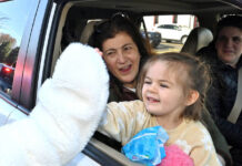 Pittston hosts Easter giveaway
Four-year-old Olivia Dombrowski gives the Easter Bunny a high-five as her grandmother, Nancy Jo Gubbiotti, looks on at the City of Pittston Easter goodies giveaway.